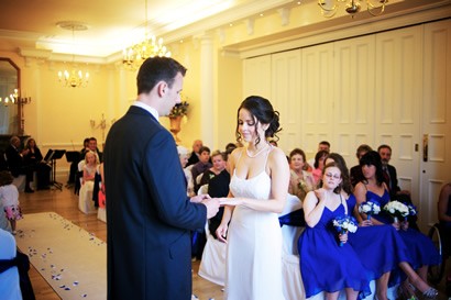 Bride and groom exchanging rings